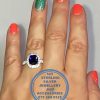 925 Sterling Silver Ring with Halo Large Blue Rectangular cubic and cubics down sides