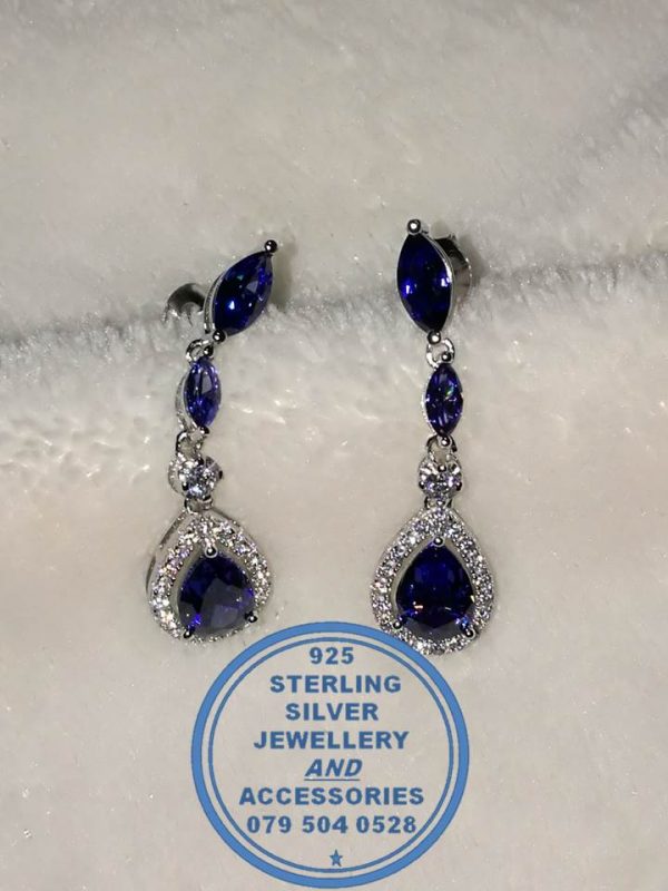 "925 Sterling Silver Dangle Showstopper earring with blue teardrop and 2 smaller leave shape blue with clear cubic detail"