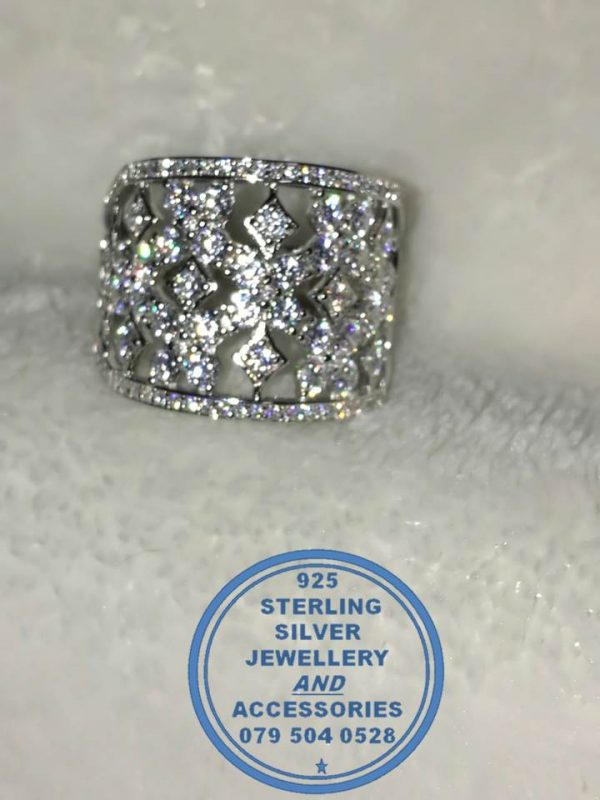 "925 Sterling Silver Ring with diamond and round cubics set as multible bands as 1. Statement. Stunning. Must Have Dress Ring"
