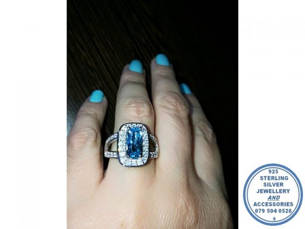 925 Sterling Silver Ring with Extra  Large AQUA Blue Rectangular cubic with clear cubics all around and going down on sides of this ring